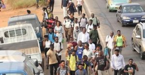 people walking to their destinations following a strike by commercial drivers