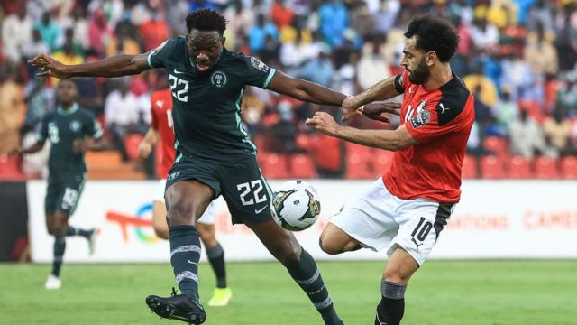 Kenneth Omeruo of Nigeria and Mohammed Salah of Egypt challenge for ball in their Group D match at the 2021 AFCON in Cameroon. Nigerian won by a lone goal