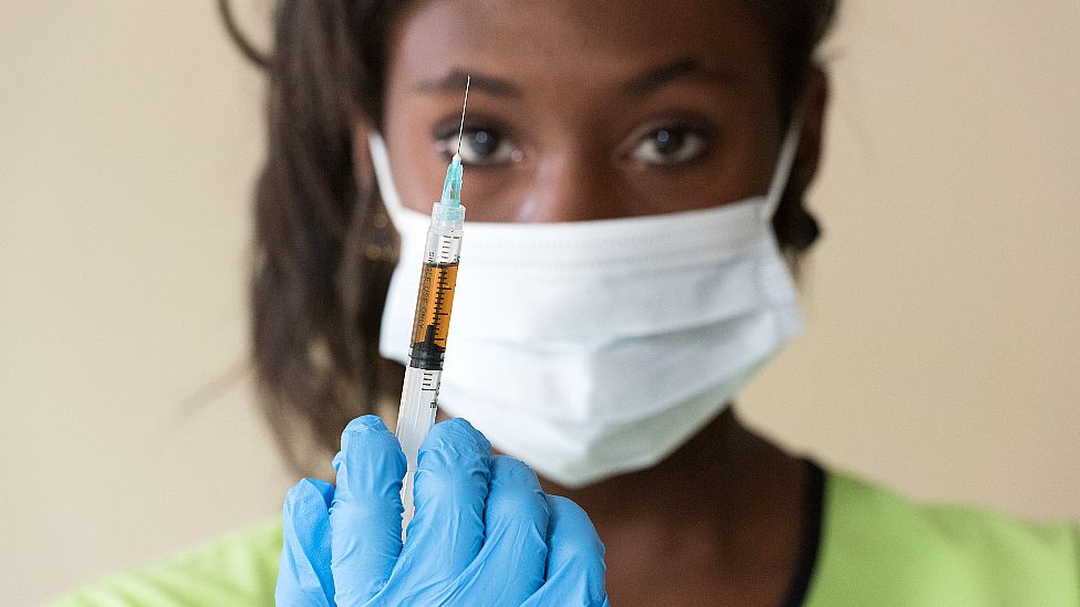 Nurse holding syringe