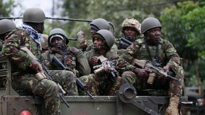Military men in a car bucket