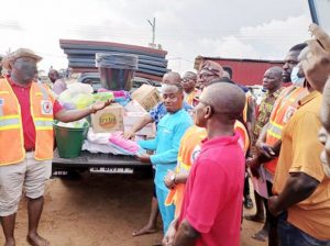NADMO officials distributing relief items
