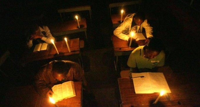 people using candles during power outages
