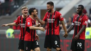 Olivier Giroud and Franck Kessie celebrate with Milan team mates
