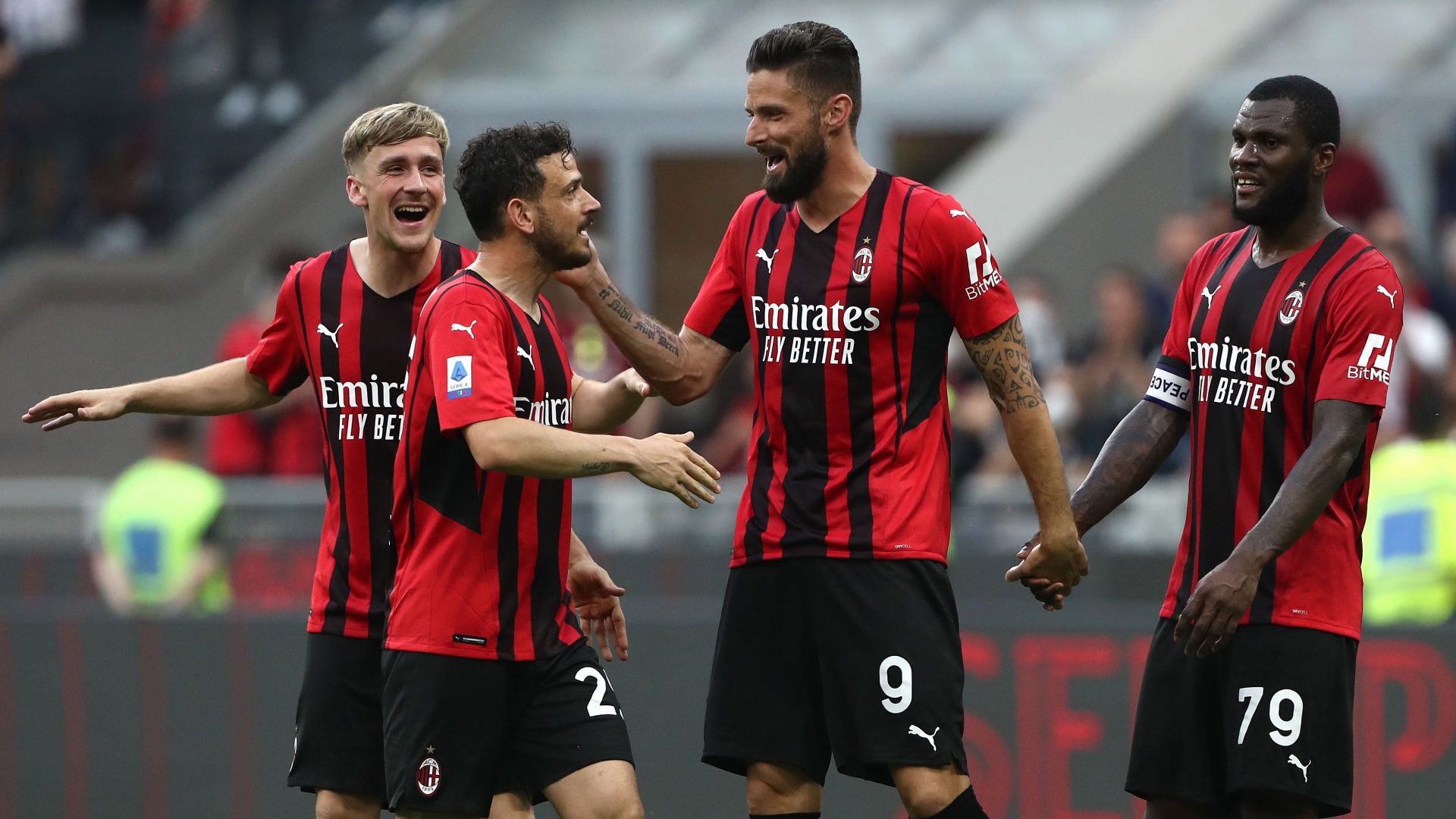 Olivier Giroud and Franck Kessie celebrate with Milan team mates