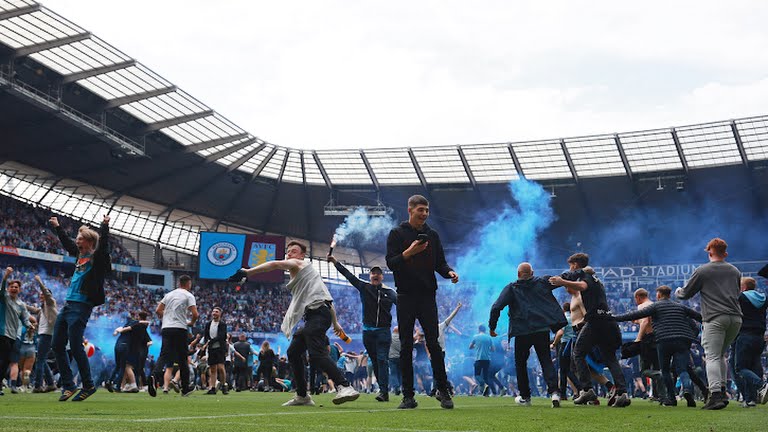 Manchester City players and supporters celebrate their final day Premier League title win after a 3-2 win over Aston Villa