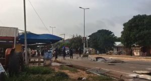 Police on the road after dispersing Nkoranza youth who were burning tyres in protest of the killing of a colleague