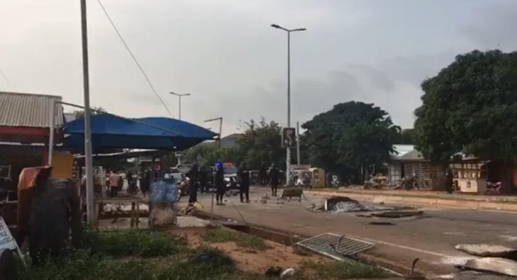 Police on the road after dispersing Nkoranza youth who were burning tyres in protest of the killing of a colleague