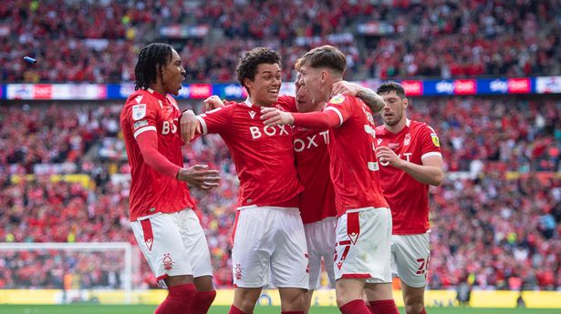 Nottingham players celebrating their Championship playoff win against Huddersfield