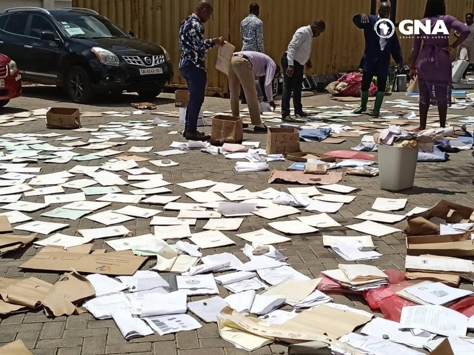 documents of lands commission dried outside after rain water flooded the office