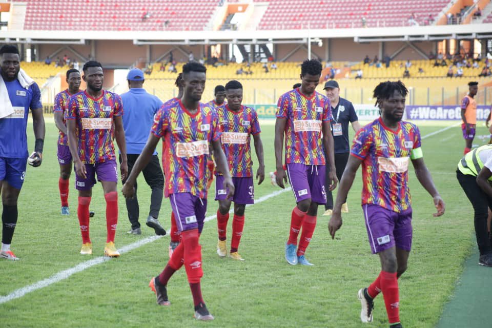 Hearts of Oak players walk off the field after a match