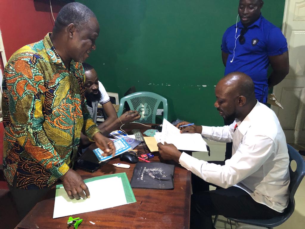 Albert Aheto checking his nomination forms