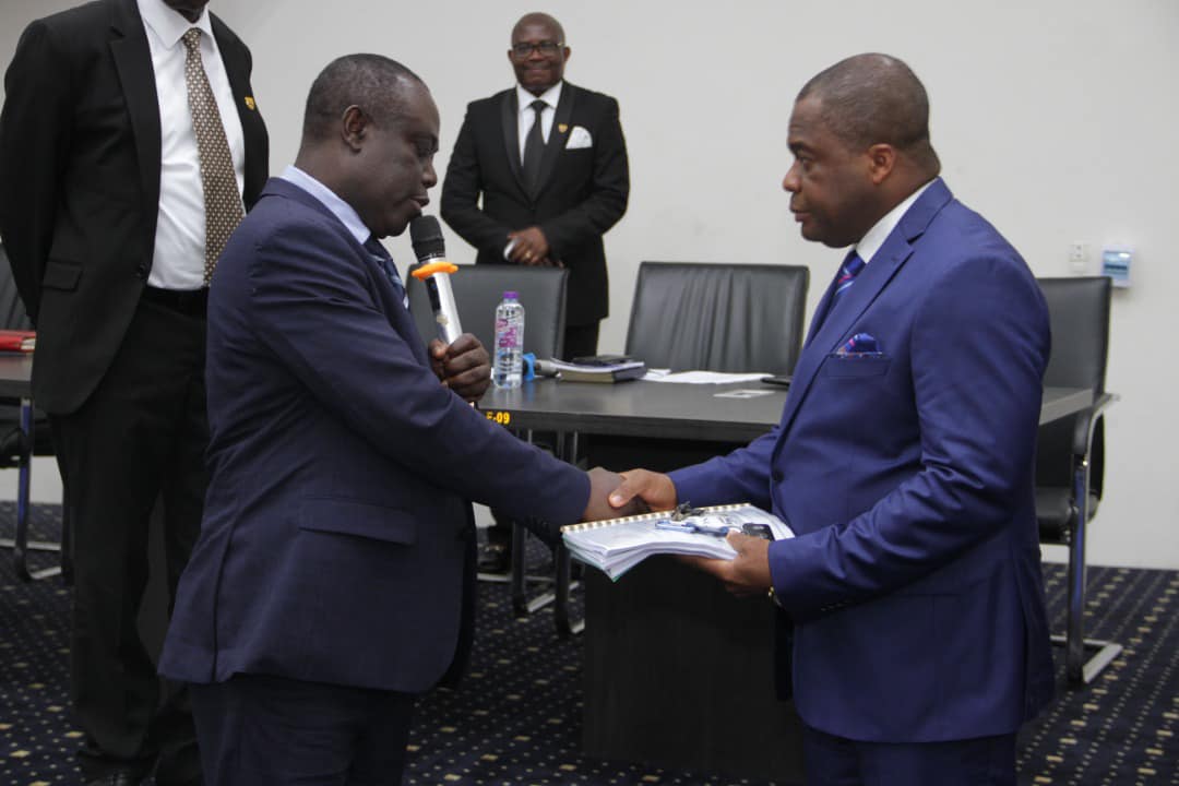 Dr Stephen Wengam being handed over to by Rev Paul Frimpong Manso as Superintendent of the Assemblies of God Church Ghana