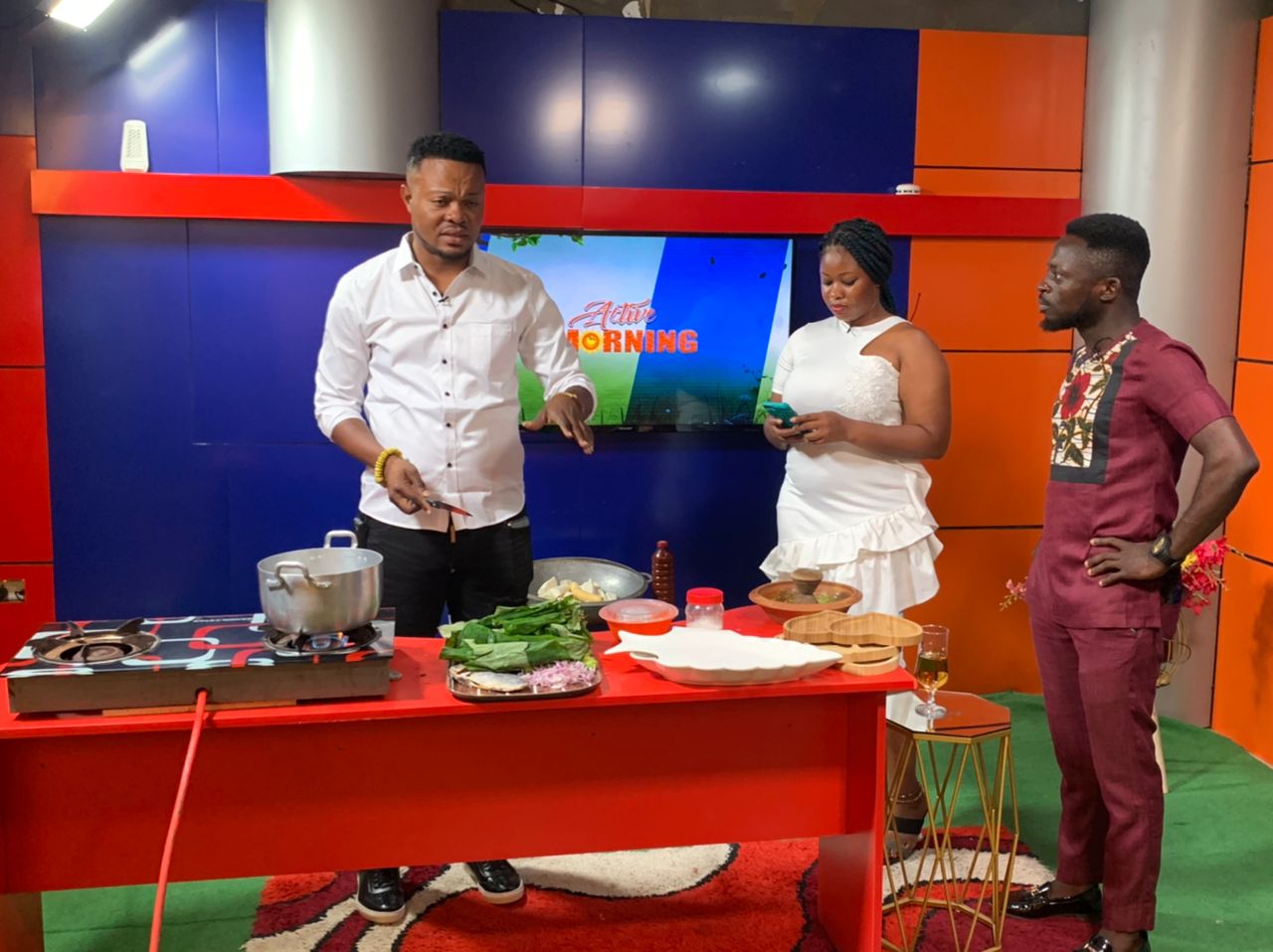 Precious Kweku Senafiawo - CEO of Active TV during a live cooking session on TV. With him are Maame Abena Fabia and Clement Annor (Host and Co-host)