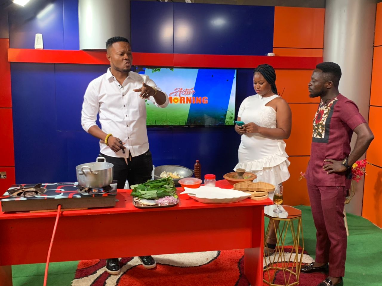 Precious Kweku Senafiawo - CEO of Active TV during a live cooking session on TV. With him are Maame Abena Fabia and Clement Annor (Host and Co-host)