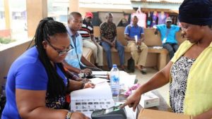 People queue to register for Voter ID cards