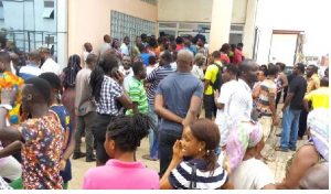 Customers form long queues at ECG office