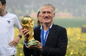 Didier Deschamps holding the World Cup trophy