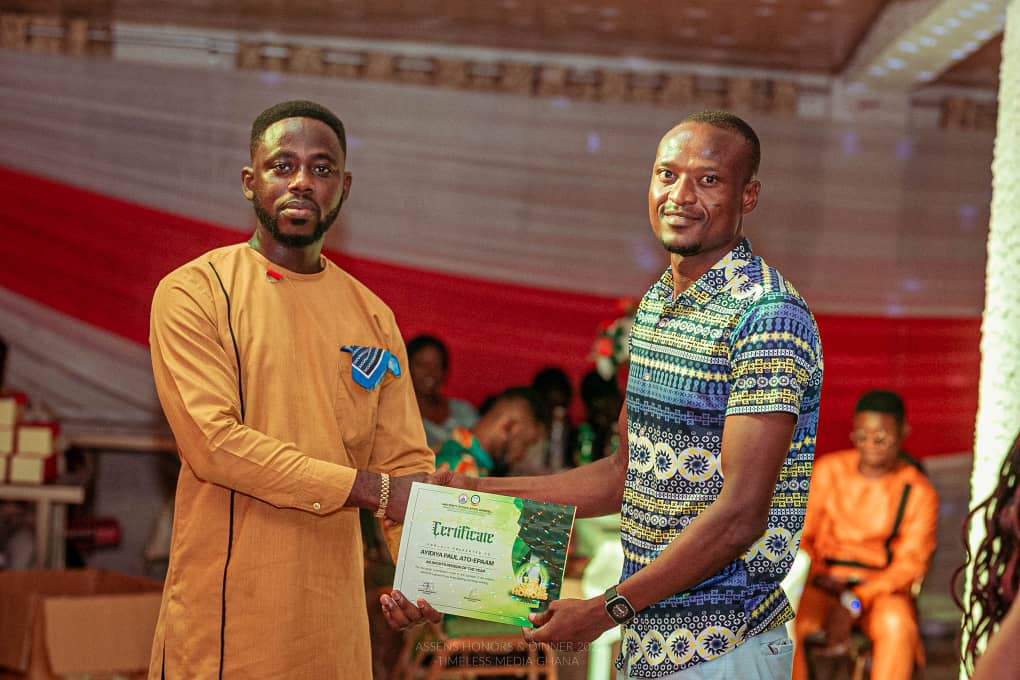 Paul Ayidiya receiving a citation