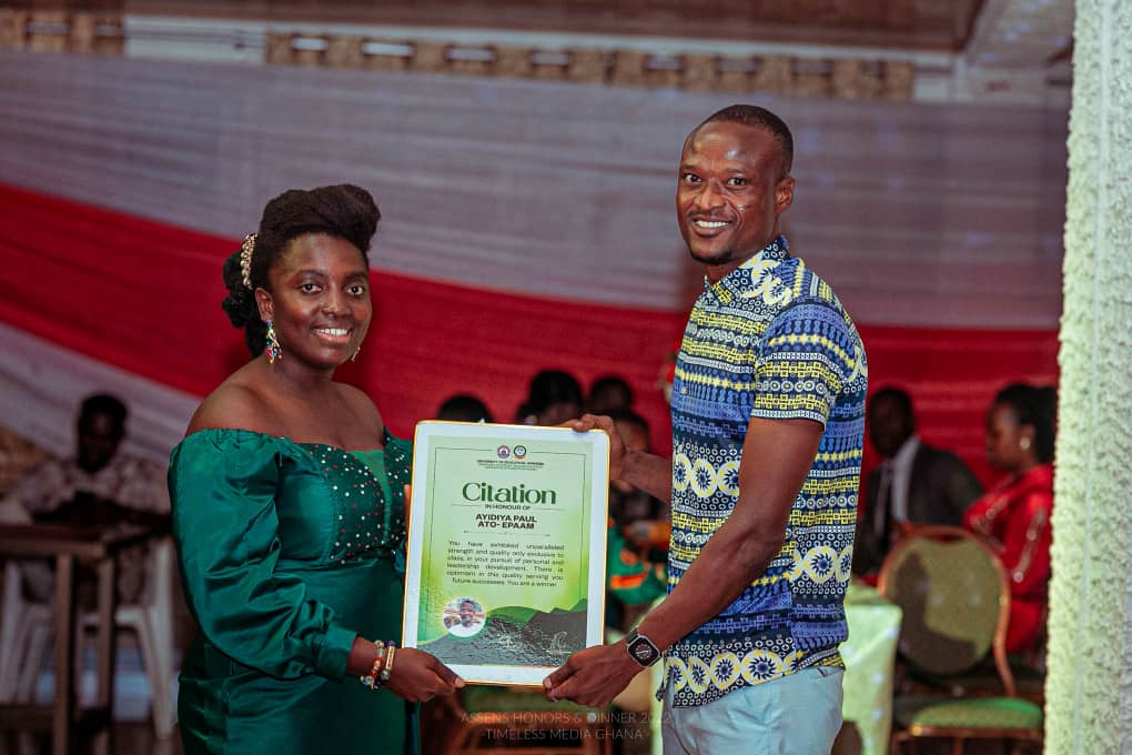 Paul Ayidiya receiving a citation