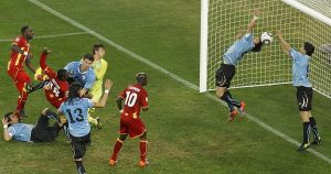Luis Suarez stops a Dominic Adiyiah header from scoring during the 2010 World Cup in South Africa