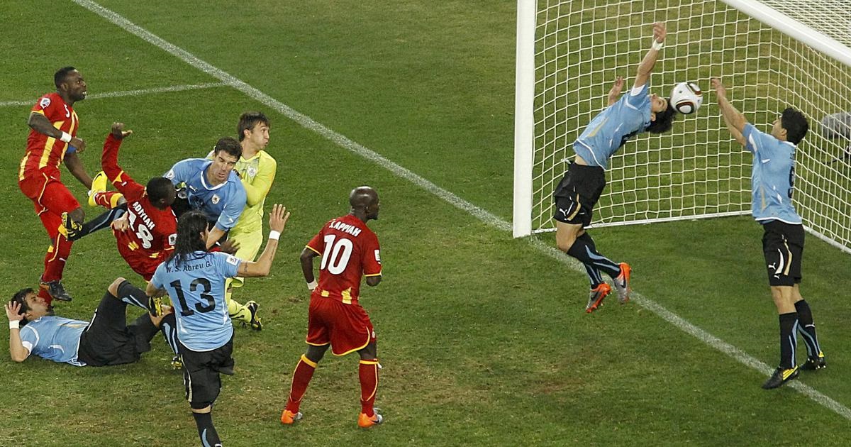 Luis Suarez stops a Dominic Adiyiah header from scoring during the 2010 World Cup in South Africa